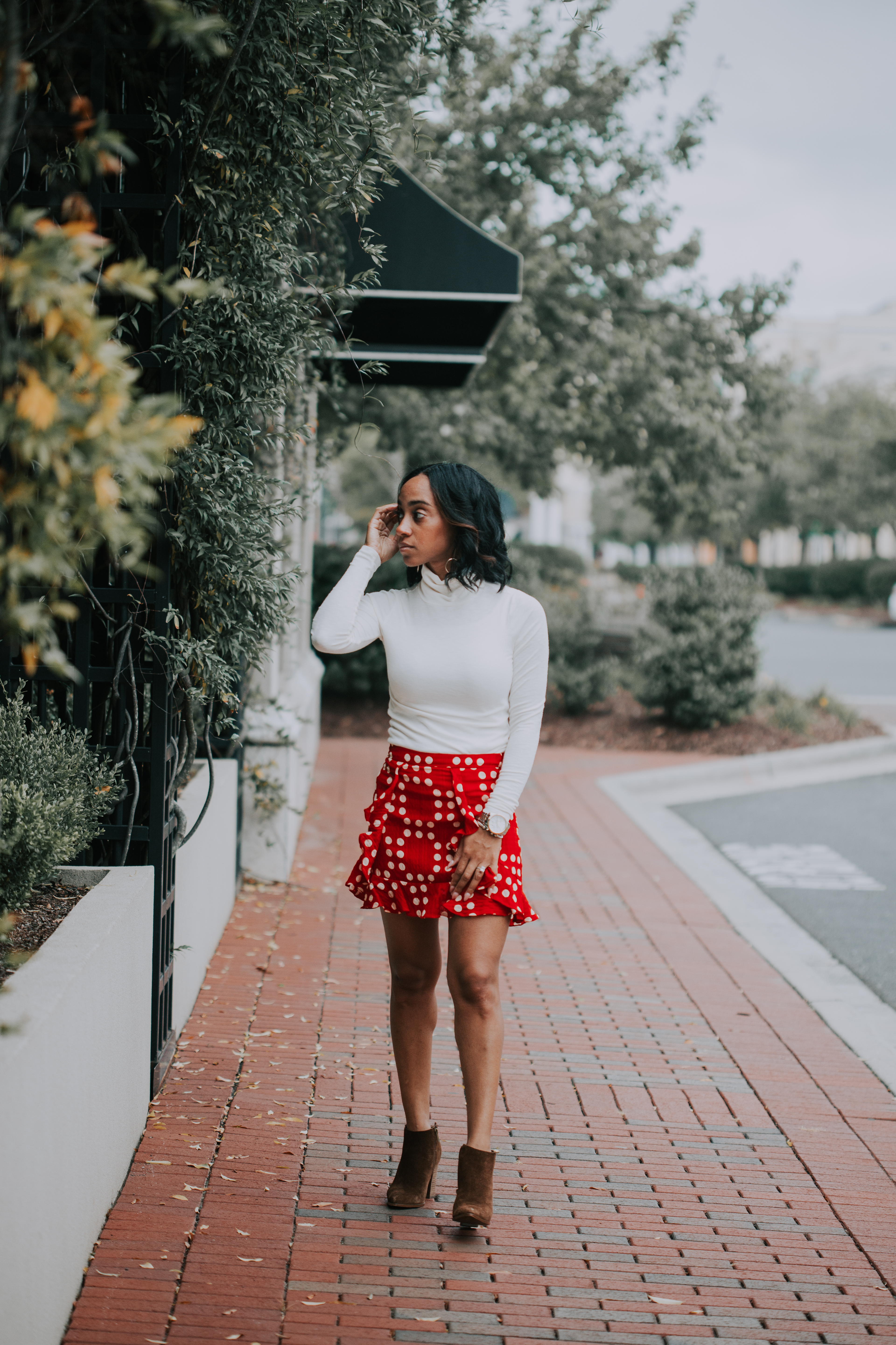 woman wearing white top and red skirt on Southern Fall
