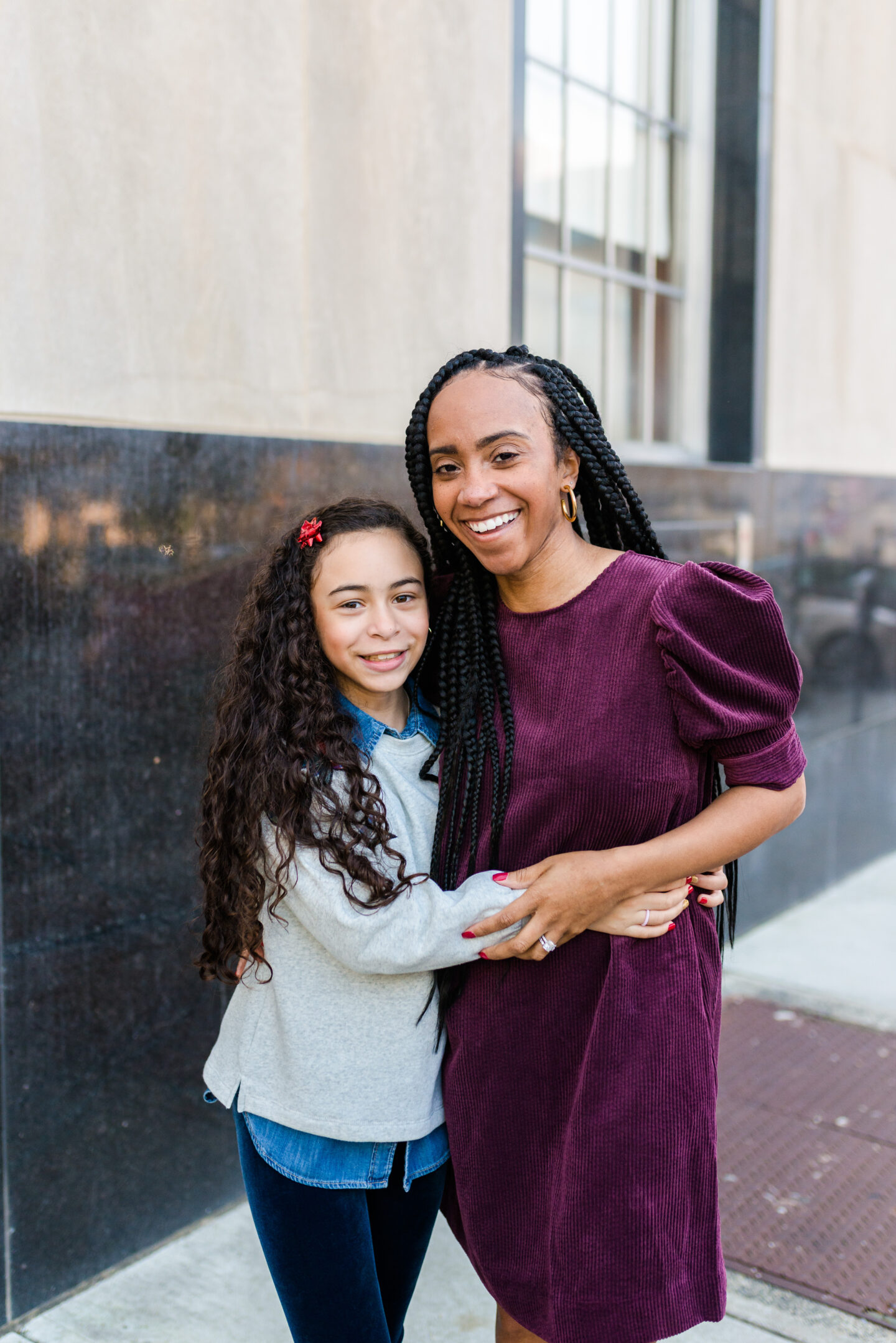 happy mother and daughter hugging 