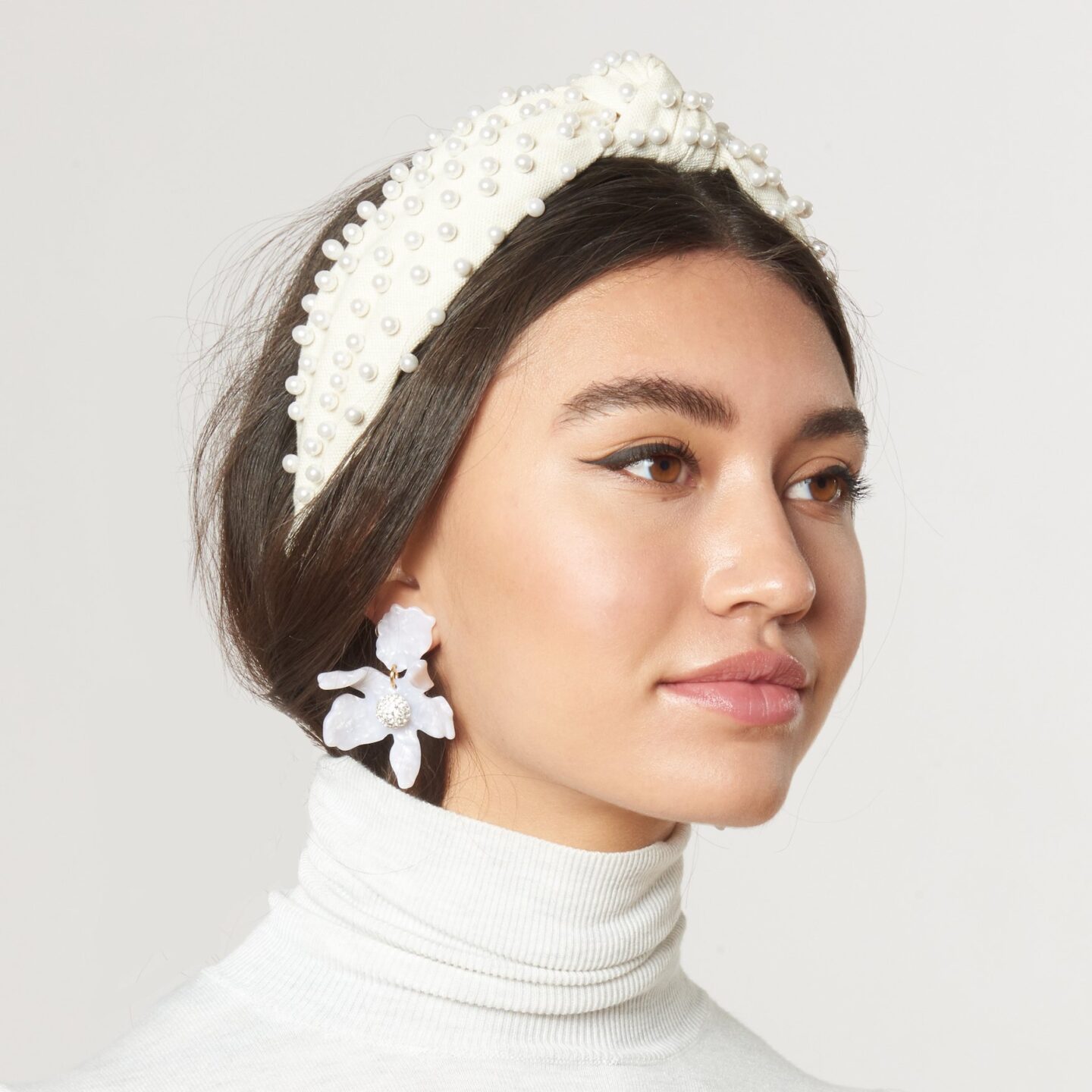 woman wearing white headband with pearls
