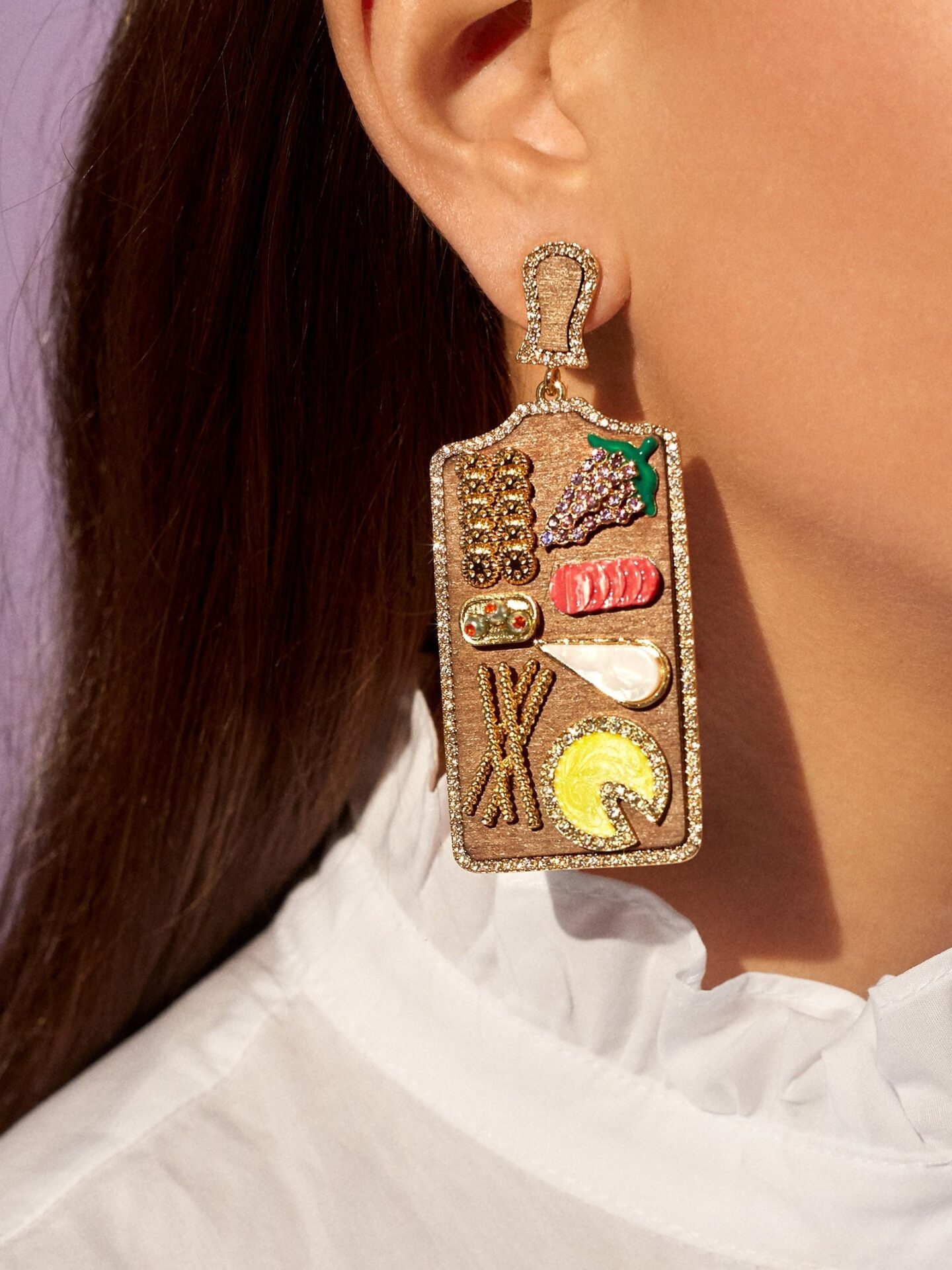 woman wearing food themed earrings 