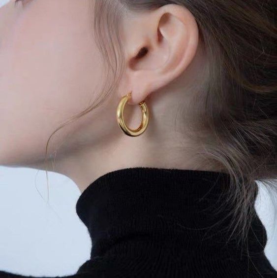 side photo of a woman wearing hoop earrings for Zoom Ready Jewelry